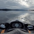 jetski on a reflective lake