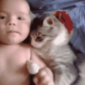 baby and cat cuddles